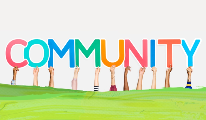 the word community held up by different hands